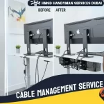 Expert electrician organizing wires with professional cable management services in Dubai